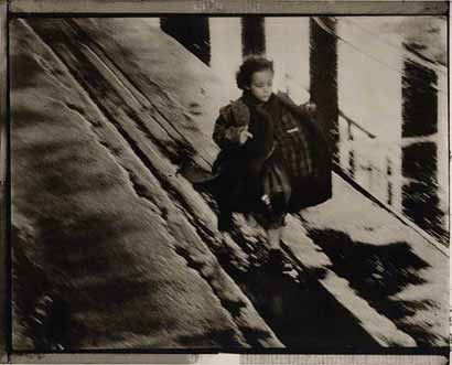 She runs under the bridge along the railway.